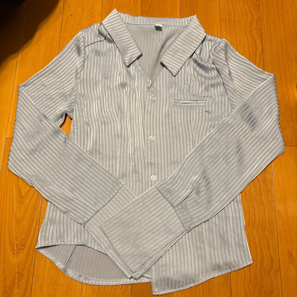 Light blue women’s button up shirt